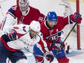 Canadiens defenceman Shea Weber battles Capitals' Alex Ovechkin in front of Carey Price during a game at the Bell Centre last year.