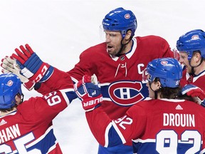 Canadiens captain Shea Weber (6) celebrates with teammates Andrew Shaw (65), Jonathan Drouin (92) and Brett Kulak after scoring against the New York Rangers during first period of NHL game at the Bell Centre in Montreal on Dec. 1, 2018.