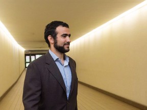 Omar Khadr leaves court after a judge ruled to relax bail conditions in Edmonton on Friday, Sept. 18, 2015.