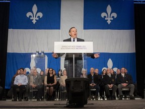 Quebec Premier François Legault speaks to families and seniors after his government tabled a financial update, at a news conference, Monday, Dec. 3, 2018 in Quebec City.
