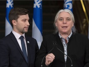 Quebec Solidaire third opposition Leader Manon Masse responds to reporters questions at a news conference marking the end of the fall session, Friday, December 7, 2018 at the legislature in Quebec City. Quebec Solidaire MNA Gabriel Nadeau-Dubois, left, looks on.