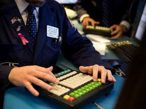 Traders work on the floor of the New York Stock Exchange (NYSE) in New York, U.S., on Friday, Dec. 14, 2018.