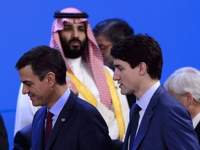 Crown Prince of Saudi Arabia Mohammed bin Salman looks toward Prime Minister Justin Trudeau as they arrive to take part in a family photo at the G20 Summit in Buenos Aires, Argentina on Friday, Nov. 30, 2018.