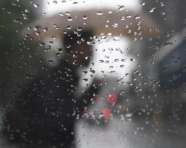 On a typical rainy day in September, I was waiting in my car for a photo subject to arrive for a shoot. Rain was falling on the windshield, and I waited for someone with an umbrella to walk by.