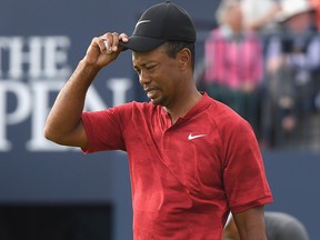 Tiger Woods of the United States acknowledges the crowd on the 18th green during the final round of the 147th Open Championship at Carnoustie Golf Club on July 22, 2018, in Carnoustie, Scotland.