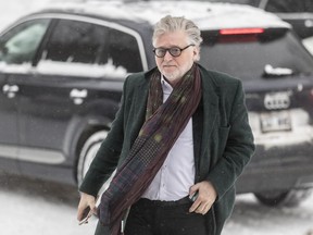 Just for Laughs founder Gilbert Rozon arrives the Montreal Police Operational Centre to complete paperwork ahead of his rape trial, which is scheduled to start Jan. 22.