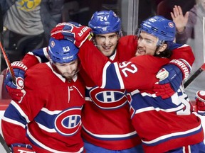 Montreal Canadiens centre Phillip Danault, flanked by Jonathan Drouin, right, and Victor Mete celebrate Danault's goal during second period against the Florida Panthers in Montreal on Jan. 15, 2019. At age 25 Danault is in the statistical prime of his career, playing excellent hockey and facing the best players in the NHL while he does it.