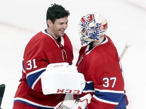 Carey Price congratulates backup goalie Antti Niemi after he made 52 saves in a 5-1 win over the Florida Panthers in NHL game at the Bell Centre in Montreal on Jan. 15, 2019.