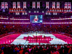 The Canadian flag is projected onto the ice at the Bell Centre during the singing of the national anthems prior to National Hockey League game between the Montreal Canadiens and the Florida Panthers in Montreal on Jan. 15, 2019.