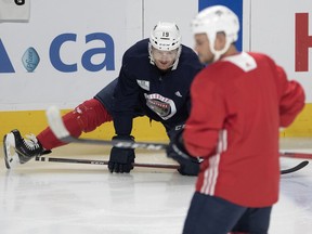 Pointe-Claire native and Panthers defenceman Mike Matheson stretches during team practice at the Bell Centre on Tuesday morning.