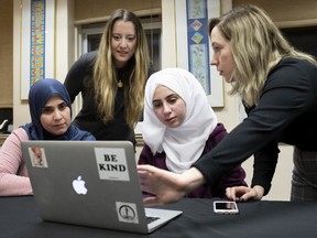 Ghfran Almahamed (from left), Gillian Sonin, Saja Almahamed and Kat Romanow plan a Shabbat dinner to be held at an event at Temple Emanuel-El-Beth Sholom as part of Muslim Awareness Week.