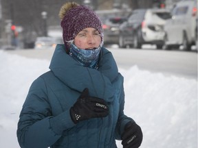 Melanie Fournier goes for a run along Sherbrooke St. near La Fontaine Park on a very cold winter day in Montreal, on Monday January 21, 2019.