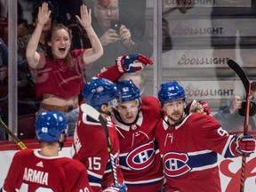 Montreal Canadiens' Jonathan Drouin (92) is congratulated by teammates Joel Armia (40), Jesperi Kotkaniemi (15) and Tomas Tatar (90) after scoring during first period at the Bell Centre in Montreal on Jan. 23, 2019.