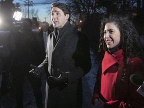 Prime Minister Justin Trudeau speaks to volunteers prior to his door-to-door campaigning with Outremont riding candidate Rachel Bendayan, right, on Monday, Jan. 28, 2019. A byelection in the riding is set for Feb. 25, 2019.