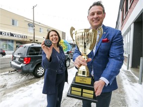Enrico Ciccone, MNA for the Marquette riding, and Lachine Mayor Maya Vodanovic with the trophy given to the winner of the inaugural hockey tournament to take place outside on Notre Dame St. in the Lachine borough.