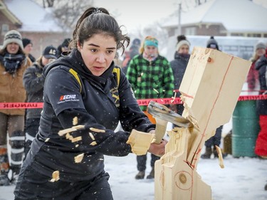 Gaby Sabat from Dalhousie Agricultural Campus in Truro, Nova Scotia, delivers the finishing chop while competing in the vertical chop event during the 59th annual Woodsmen competition at the MacDonald Campus of McGill University in Ste-Anne-de-Bellevue on Saturday Jan. 26, 2019.