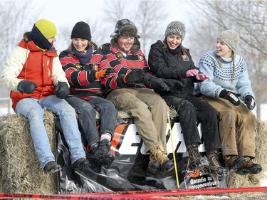 McGill students and competitors have fun while sitting on hay bales during the 59th annual Woodsmen competition at the MacDonald Campus of McGill University in Ste-Anne-de-Bellevue on Saturday Jan. 26, 2019.