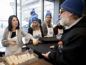 Mayor Valérie Plantes gives out cupcakes as part of the lunch service at the Old Brewery Mission on Wednesday.