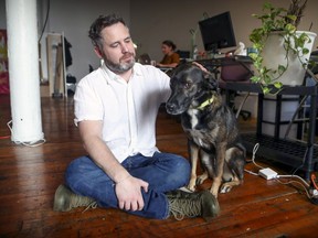 Motorleaf CEO Alastair Monk with his dog Floyd in his company's office in Montreal on Wednesday.