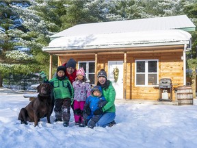 From left, Ronnie, Tetsu, Nika, Akila and Yuko Yung visit Domaine Yamaska, a cluster of comfortable chalets in Bromont. Bèa, a Labrador Retriever, is the house dog.