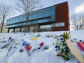 Floral and other tributes are seen around the Centre culturel islamique de Québec in the days following the mass shooting there on Jan. 29, 2017.