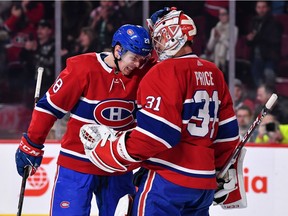 Canadiens defenceman Mike Reilly congratulates goaltender Carey Price after 3-0 win over the Colorado Avalanche in NHL game at the Bell Centre in Montreal on Jan. 12, 2019.