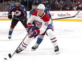 Canadiens' Jesperi Kotkaniemi battles Avalanche's Carl Soderberg for the puck during the teams' encounter in December.