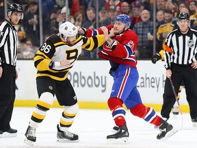 Kevan Miller #86 of the Boston Bruins fights Nicolas Deslauriers #20 of the Montreal Canadiens during the first period at TD Garden on January 14, 2019 in Boston.