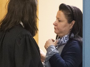 Adele Sorella leaves a meeting room with her lawyers during her trial at the Laval courthouse on Tuesday November 20, 2018.
