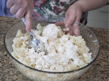 Diane Zalusky mixes filling for varenyky. Here the filling is mashed russet potato and farmer's cheese in a ratio of 2:1 in favour of potato. She  makes another batch filled with sauerkraut held together with a bit of potato. (Allen McInnis / MONTREAL GAZETTE)