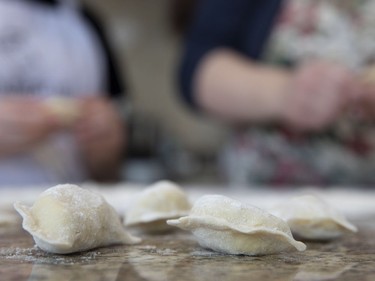 Varenyky being shaped by Diane Zalusky and her daughter, Eve Normand. (Allen McInnis / MONTREAL GAZETTE)