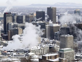 MONTREAL, QUE.: DECEMBER 30, 2017 -- Plumes of steam come off buildings in downtown Montreal Saturday December 30, 2017 as the city deals with unseasonally cold temperatures. (John Mahoney / MONTREAL GAZETTE) ORG XMIT: 59967 - 2140