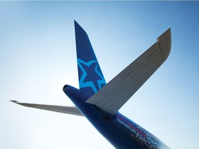 MONTREAL, QUE.: December 20, 2011--  Air Transat has a new colour scheme: the Welcome mosaic, the star on the tail and the blue rear fuselage.  (BIZ)