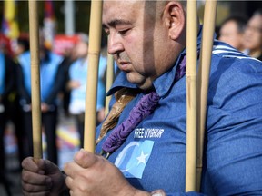 Uighur people demonstrate against China outside of the United Nations (UN) offices during the Universal Periodic Review of China by the UN Human Rights Council, on November 6, 2018 in Geneva.