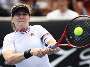 Canada's Eugenie Bouchard hits a return against China's Peng Shuai during their women's singles match on day two of the Australian Open tennis tournament in Melbourne on January 15, 2019.