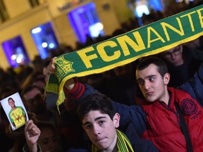 FC Nantes football club supporters gather in Nantes after it was announced that the plane Argentinian forward Emiliano Sala was flying on vanished during a flight from Nantes in western France to Cardiff in Wales, on January 22, 2019. - The 28-year-old Argentine striker is one of two people still missing after contact was lost with the light aircraft he was travelling in on January 21, 2019 night. Sala was on his way to the Welsh capital to train with his new teammates for the first time after completing a £15 million ($19 million) move to Cardiff City from French side Nantes on January 19.