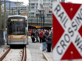 A Bombardier Olympic Line train departs from near the Olympic Village Canada Line Station in Vancouver, B.C., on Thursday, January 21, 2010. Bombardier Inc. has signed a US$669-million contract to provide 113 commuter rail cars to New Jersey.
