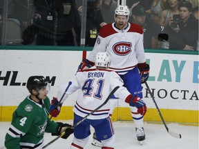 Canadiens defenceman Jeff Petry (26) celebrates his winning goal withPaul Byron as Dallas Stars defenceman Miro Heiskanen skates away during overtime in Dallas on  Monday, Dec. 31, 2018.