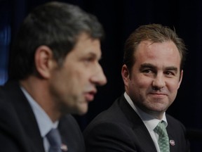 Montreal Canadiens owner Geoff Molson, right, announces Marc Bergevin as the team's new general manager in Brossard on May 2, 2012.