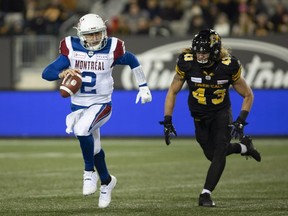 Montreal Alouettes quarterback Johnny Manziel runs away from Hamilton Tiger-Cats linebacker Lucas Wacha, who eventually makes the sack in Hamilton on Nov. 3, 2018.