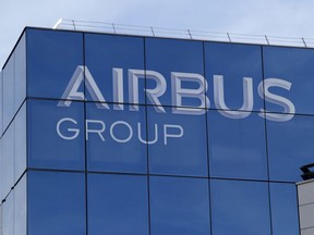 FILE - In this May 6, 2016 file photo, the logo of the Airbus Group is pictured in Suresnes, outside Paris. Shares in Airbus are sinking on a report in Le Monde that the U.S. Department of Justice has opened an official investigation into alleged fraud by the European planemaker. Authorities in Britain and France were already investigating alleged fraud and bribery related to Airbus' use of outside consultants in commercial plane sales.