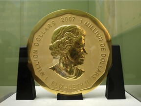 FILE - The Dec. 12, 2010 file photo shows the gold coin 'Big Maple Leaf' in the Bode Museum in Berlin. Four young men have gone on trial over the brazen theft of a 100-kilogram (221-pound) Canadian gold coin from a Berlin museum.  (Marcel Mettelsiefen/dpa via AP, file) ORG XMIT: FOS114