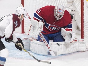 Canadiens goaltender Carey Price makes a save against Colorado Avalanche's Carl Soderberg in Montreal on Saturday, Jan. 12, 2019.