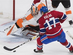 Montreal Canadiens' Brett Kulak scores against Philadelphia Flyers goaltender Carter Hart during third period NHL hockey action in Montreal, Saturday, Jan. 19, 2019.