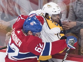 Nashville Predators' P.K. Subban is driven into the glass by Canadiens' Artturi Lehkonen in Montreal on Saturday, Jan. 5, 2019.