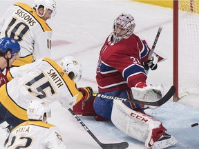 Canadiens goaltender Carey Price is scored on by Nashville Predators' Craig Smith (15) in Montreal on Saturday, Jan. 5, 2019.