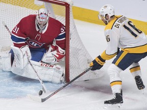 Canadiens goaltender Carey Price makes a save against Nashville Predators' Phillip Di Giuseppe in Montreal on Saturday, Jan. 5, 2019.