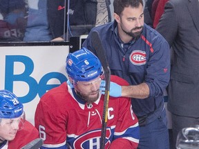 Canadiens captain Shea Weber receives medical attention on the bench after being hit by a puck in the face during first period of NHL game against the Minnesota Wild at the Bell Centre in Montreal on Jan. 7, 2019.
