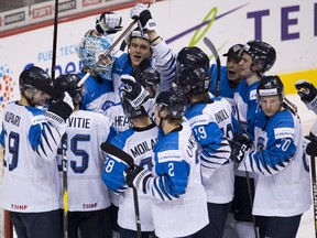 Team Finland celebrates its win over Switzerland following third period IIHF world junior semifinal hockey action in Vancouver, Friday, Jan. 4, 2019.