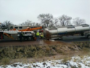 A tank trucker's trailer detached from the truck and rolled on its side on slick pavement, spilling a river of liquid chocolate onto westbound lanes of Interstate 40 in Arizona.